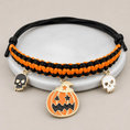 Gallery viewerに画像を読み込む, Halloween hand-woven pet collar decoration; black/orange braided band with three charms: pumpkin and two skulls.

