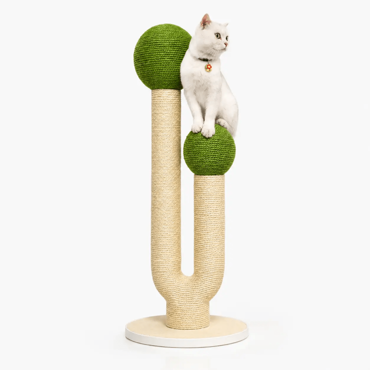 The Cactus Design Sisal Rope Cat Tower by For Animals, With Love; posts with green spheres and a white cat perched.