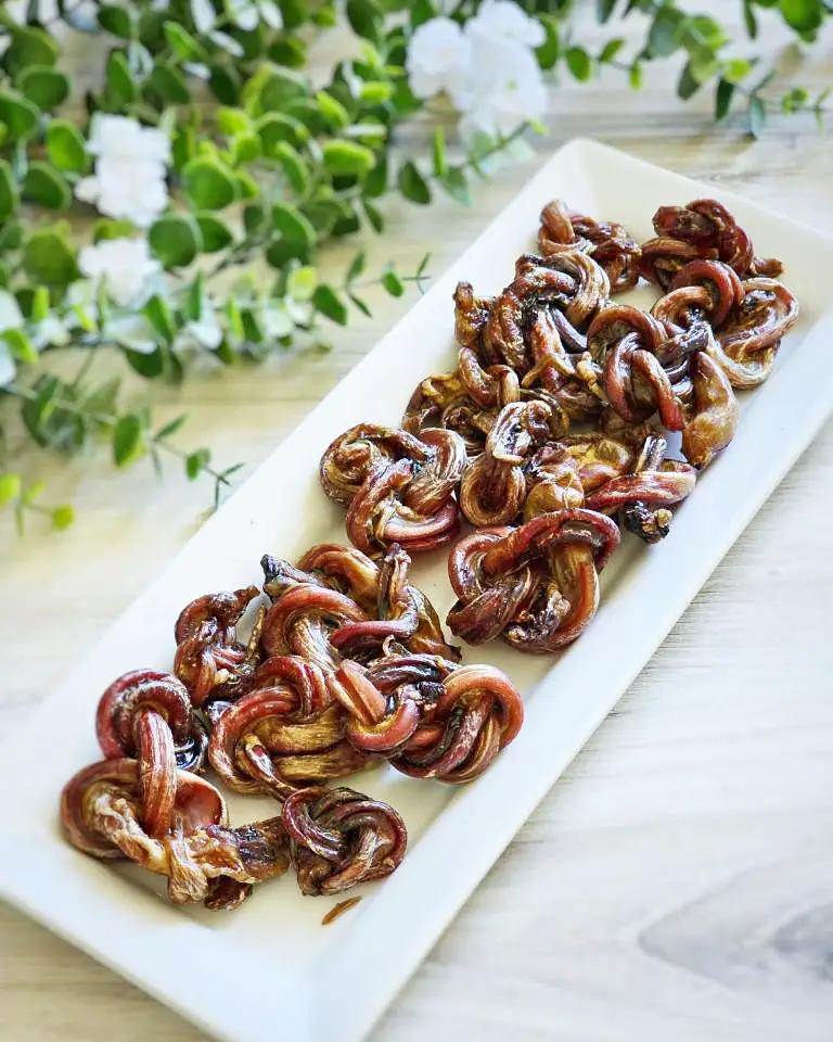 Lamb Pizzle - Limited Edition by Naked Beasts, dried twisted slices on white platter