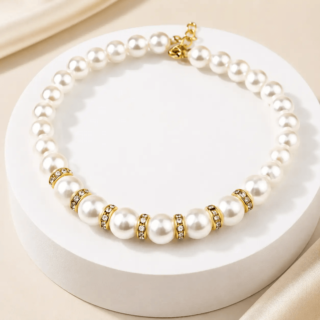 The Pearl &amp; Crystal Pet Necklace for pets with white pearls, gold-tone spacers, and crystal accents.