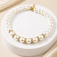 Charger l'image dans la visionneuse de la galerie, The Pearl & Crystal Pet Necklace for pets with white pearls, gold-tone spacers, and crystal accents.
