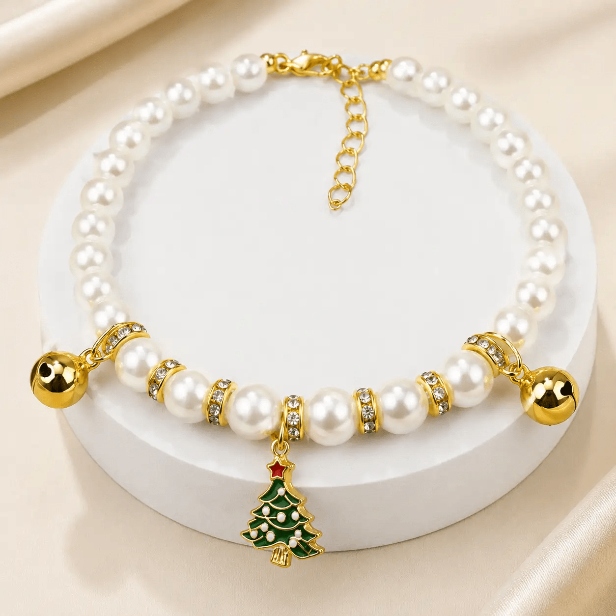 The Pearl & Crystal Pet Necklace with white pearl beads, gold-tone accents, and a festive Christmas tree charm
