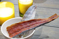 Load image into Gallery viewer, Mahi Mahi jerky fillet by Naked Beasts, wild-caught dried red fish with skin in a white bowl
