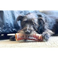 Load image into Gallery viewer, Beef Trachea chew for dogs by Naked Beasts, grass-fed and finished; dog chewing.

