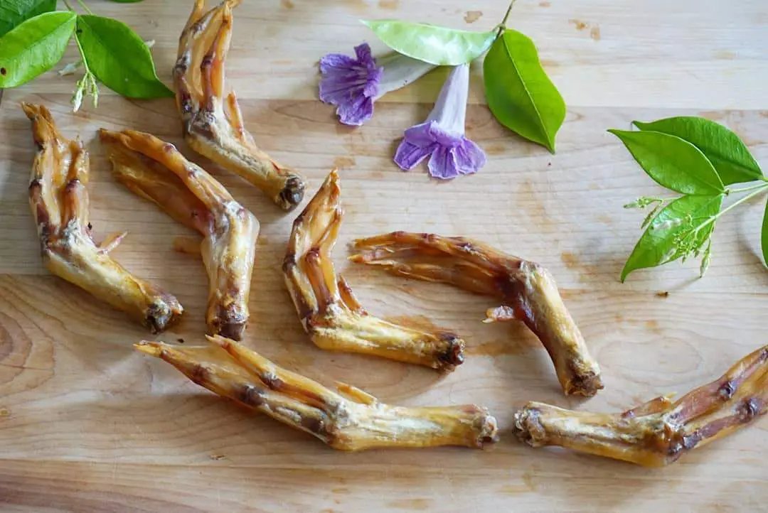 Duck Feet (ABF) by Naked Beasts, several pieces on a wooden board with green leaves and purple flowers