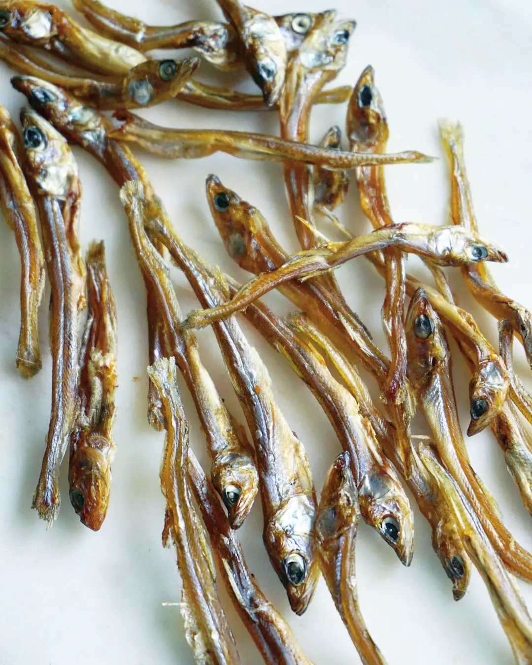 Smelt (Wild Caught) dried whole fish, Naked Beasts, golden-brown, multiple pieces