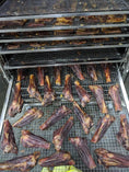 Load image into Gallery viewer, Lamb shanks by Naked Beasts, pasture-raised, on metal drying racks
