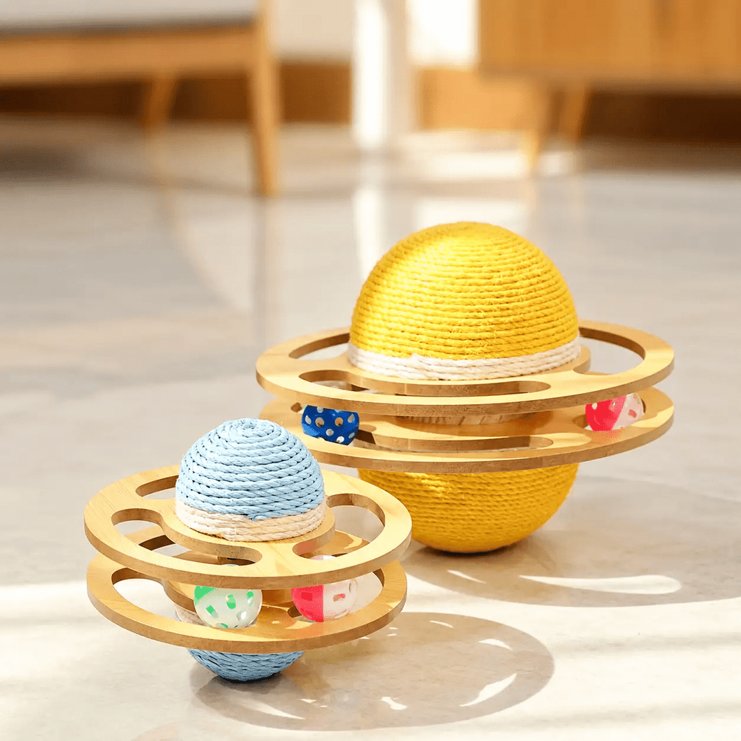 Orbit Interactive Cat Scratcher by Pet Zen; two wooden-ring toys with rope-wrapped yellow and blue spheres.