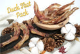 Load image into Gallery viewer, Duck Feet Pack, dried brown duck feet treats on a wooden board with pinecones
