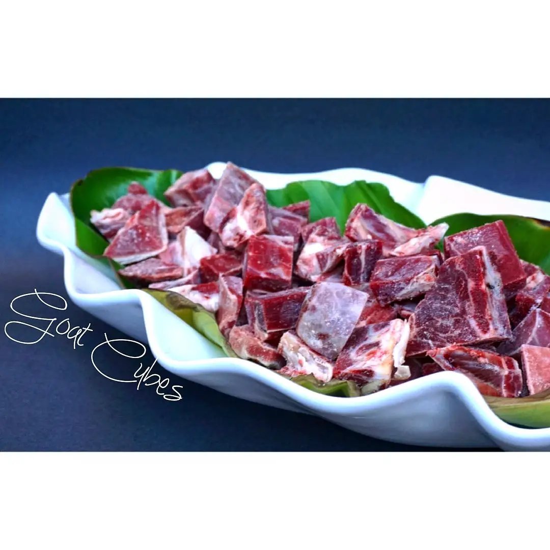Goat Cubes bone-in free-range on a white curved platter