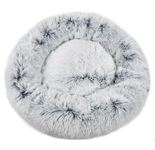 Mr. Peanut's OrthoPlush 28-inch round pet bed, ultra-soft pillow bed in snowflake white and gray faux fur.