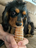 Load image into Gallery viewer, Beef Trachea chew by Naked Beasts; grass-fed and finished, dog chewing on the treat.
