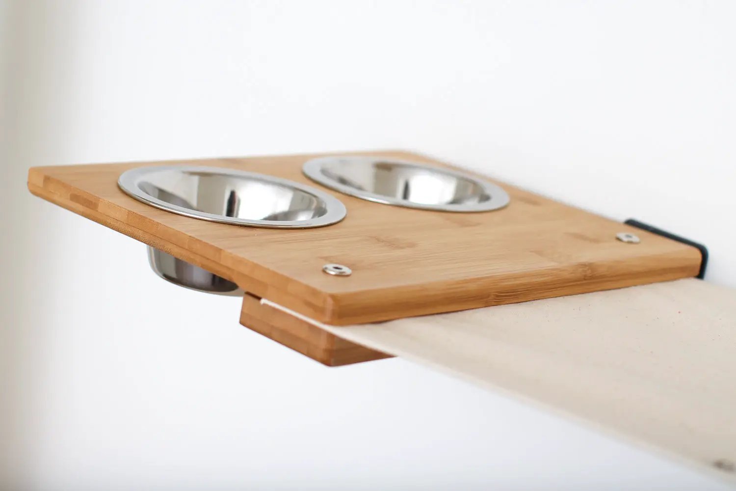 Cat condo The Bunker by Catastrophic Creations; bamboo wood panel with two stainless steel bowls