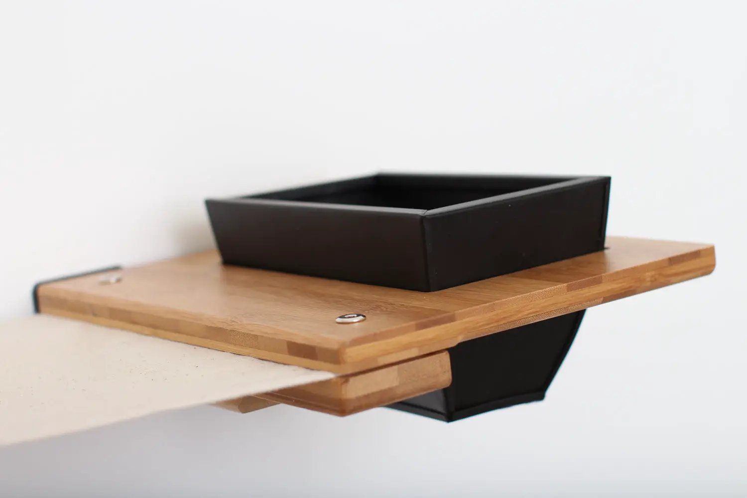 The Bunker cat condo, black multi-level cat tree with perch on a wooden shelf