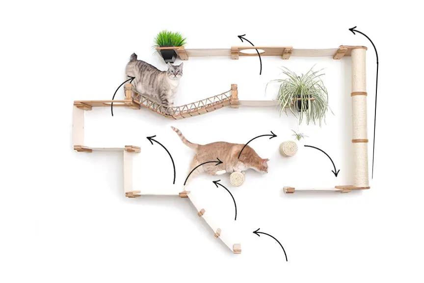 The Juggernaut Cat Condo wall-mounted indoor cat playground in natural wood with rope bridges, featuring 2 cats.