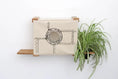 Carica l'immagine nel visualizzatore della galleria, Deluxe Cat Cubby Bed, beige fabric with circular porthole opening mounted on wooden shelves.
