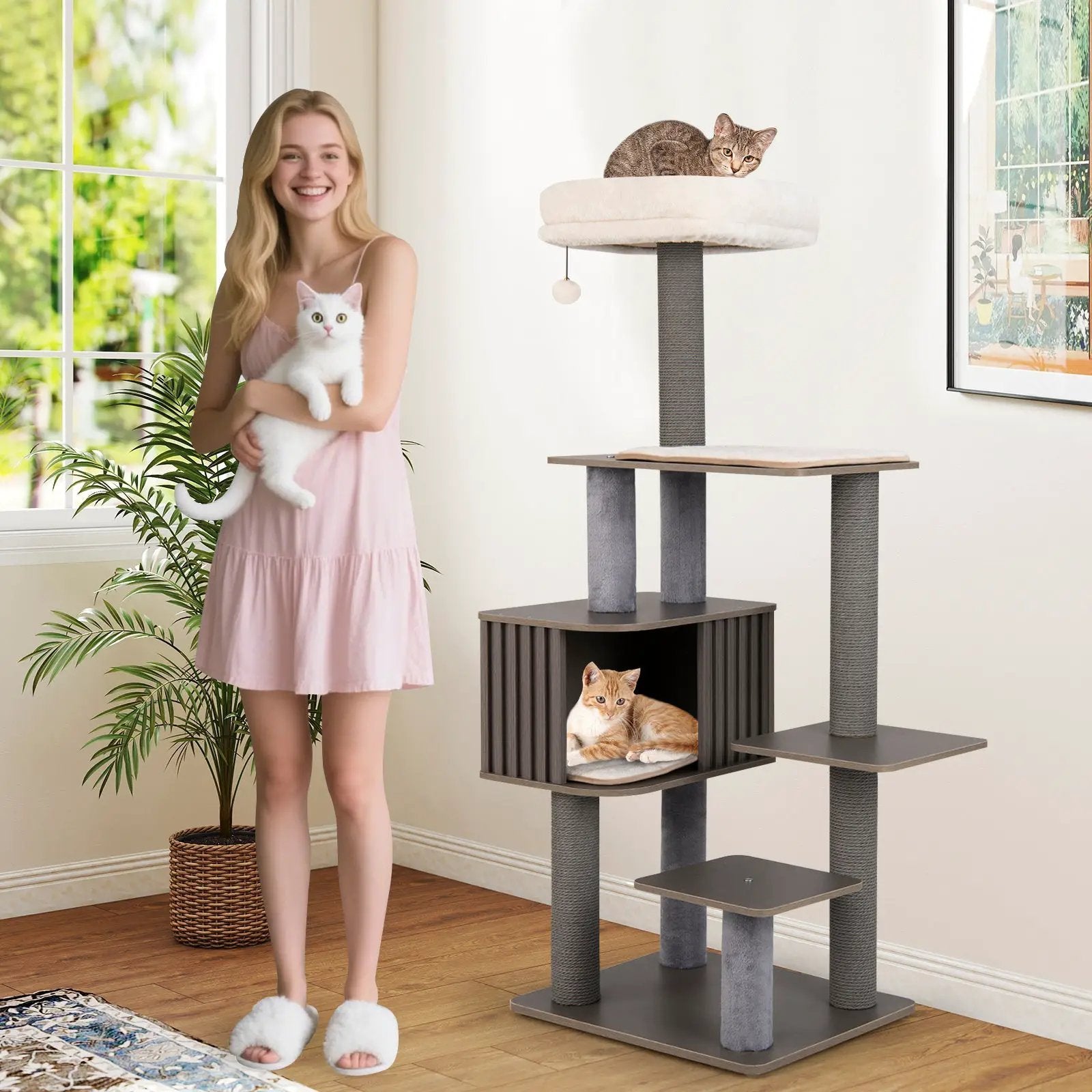 Multi-level cat tree for indoor cats with cushion-top perch and gray sisal posts; three cats visible.