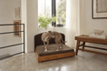 Load image into Gallery viewer, The Haven luxury handcrafted dog bed with a solid wood frame and brown cushion, two dogs lounging on it.
