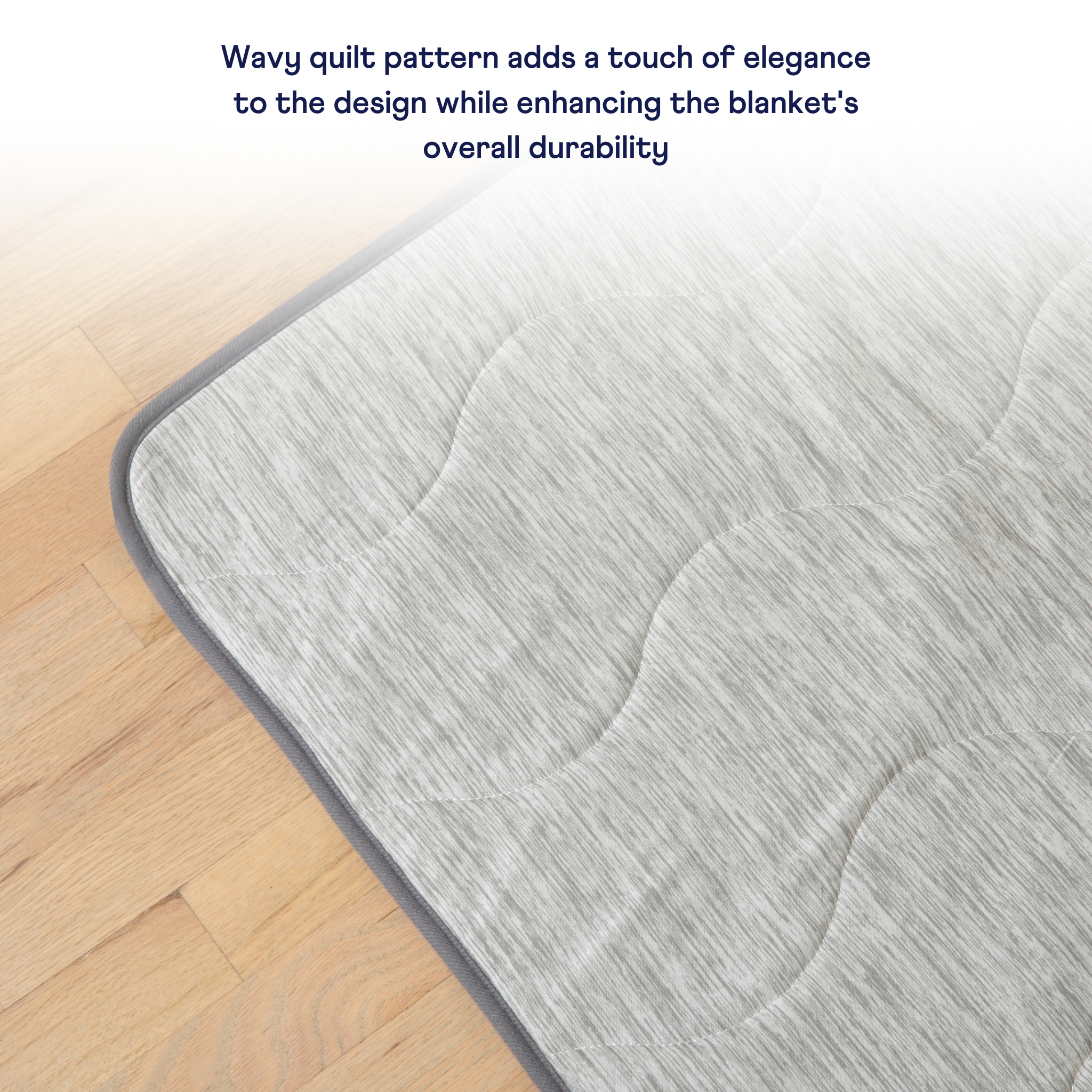 PupChill cooling waterproof blanket in Arctic Grey with a quilted pattern on a wood floor