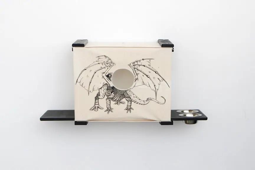 Deluxe Cat Cubby Bed - beige wooden cat condo with round entry hole and dragon illustration.