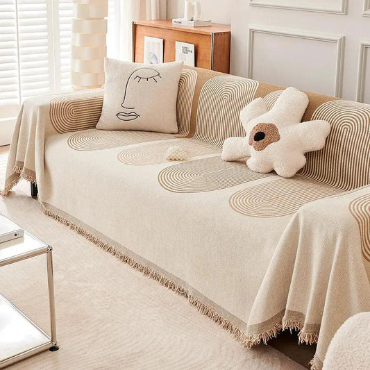 Double-Sided Chenille Couch Slipcover in beige with fringe edges on sofa by topspet