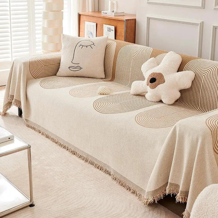 Double-Sided Chenille Couch Slipcover in beige with fringe edges on sofa by topspet