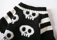 Load image into Gallery viewer, Pet Zen Halloween skull knitted sweater for pets, black with white skull pattern and striped sleeves
