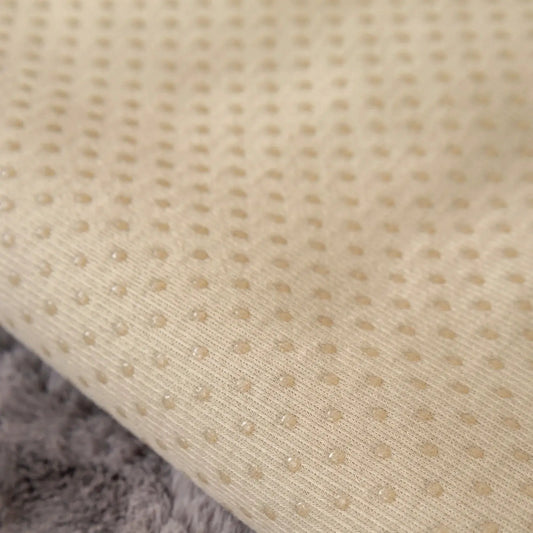Velvet couch cover in beige fabric with subtle dotted texture