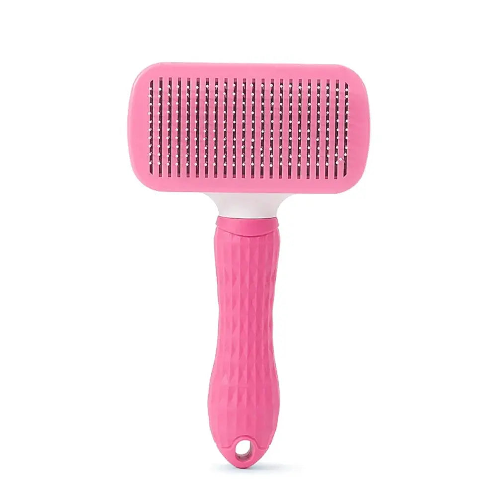 Pink deshedding grooming brush for dogs and cats with a textured handle and wide bristle head