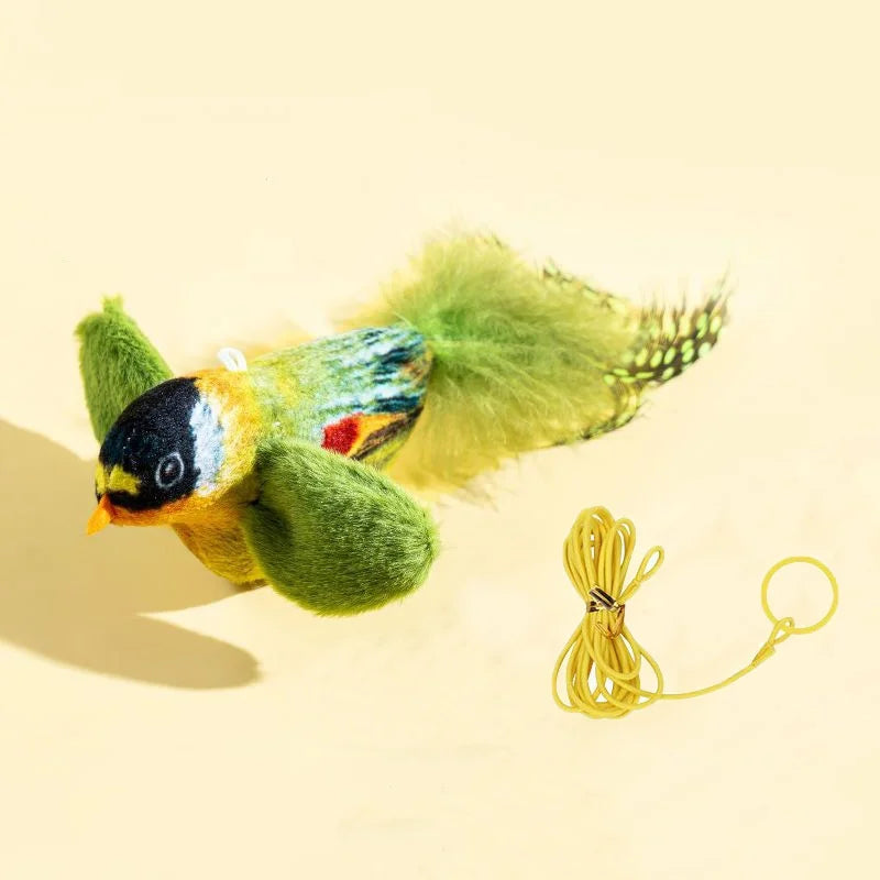 Green bird with yellow hanging cord