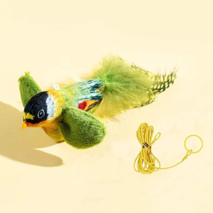 Green bird with yellow hanging cord