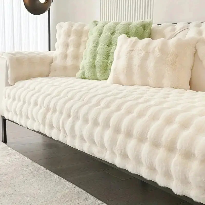 Velvet couch cover on cream sofa with plush cushions; cat and dog proof.