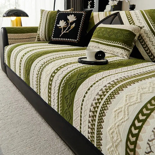 Topspet Black Couch Cover on sofa with green and cream geometric pattern and cushions, non-slip furniture protector