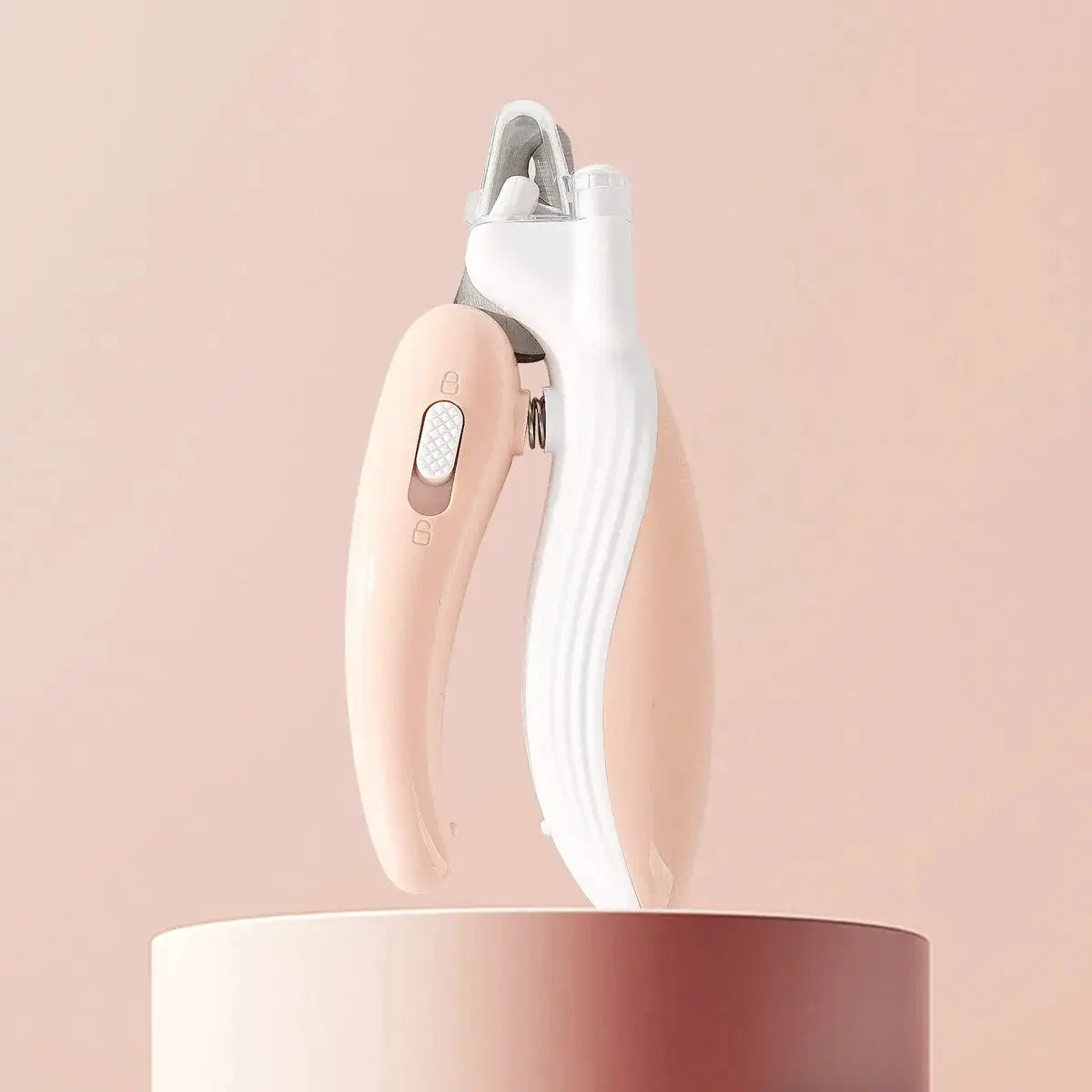 Whisker House professional pet nail clippers with LED light, pink and white handles.