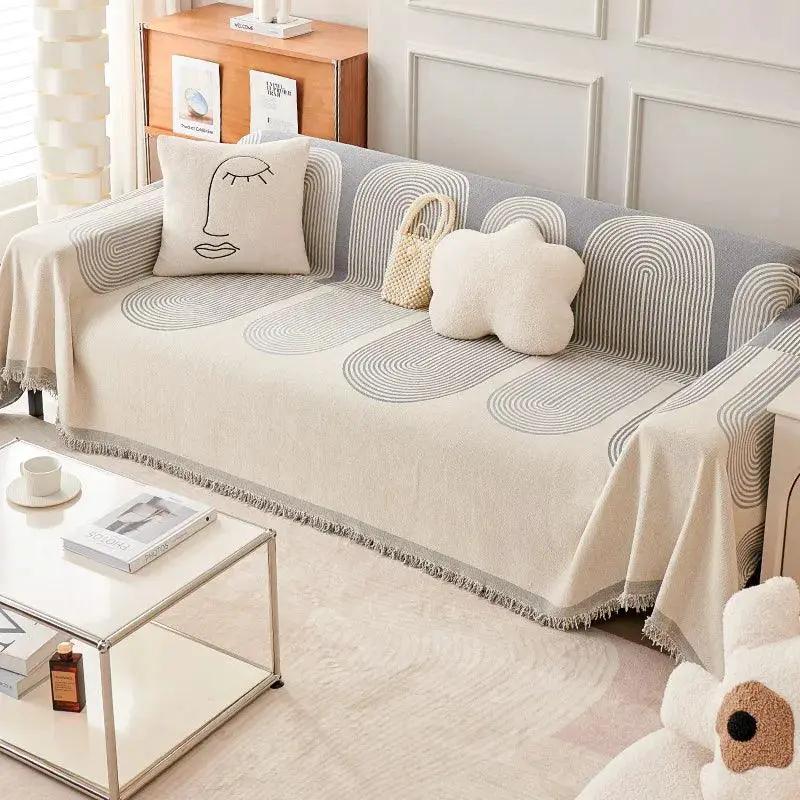 Double-Sided Chenille Couch Slipcover by topspet on a beige sofa with gray circular pattern