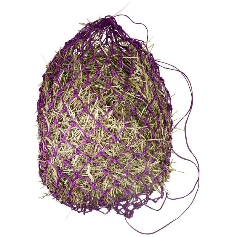 Gatsby Slow Feed Hay Net, purple netting over natural hay.