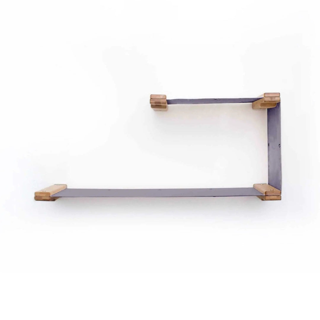 The Double Decker cat hammock mounted on a wall with purple fabric and wooden end caps