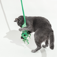 Load image into Gallery viewer, Ink Floyd wool octopus cat toy with green tentacles hanging from a string
