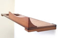 Load image into Gallery viewer, The Cat Nest Bed by Catastrophic Creations, brown wooden cat shelf/bed with curved nest opening.
