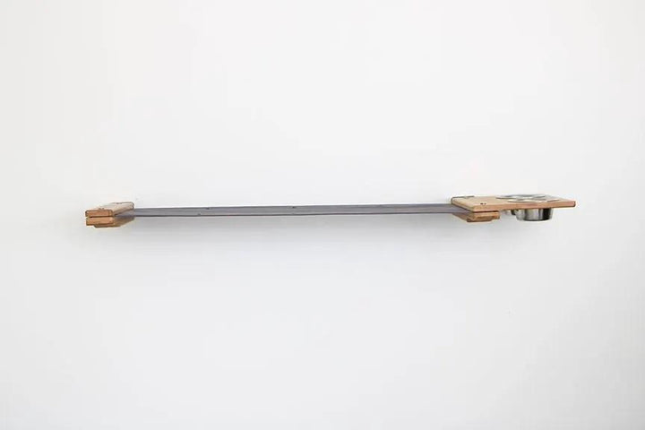 Cat Hammock by Catastrophic Creations, wall-mounted raised cat furniture with wooden ends and metal bar.