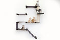 Carica l'immagine nel visualizzatore della galleria, The Deluxe Cat Fort Modern Cat Condo with purple platforms and a wrapped sisal post, several kittens perched on levels.

