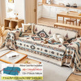Load image into Gallery viewer, Extra Large sofa cover – stretchable furniture protector in beige with blue geometric pattern on a sofa.
