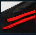 Load image into Gallery viewer, Halloween pet cape showing two red satin trim strips on black fabric
