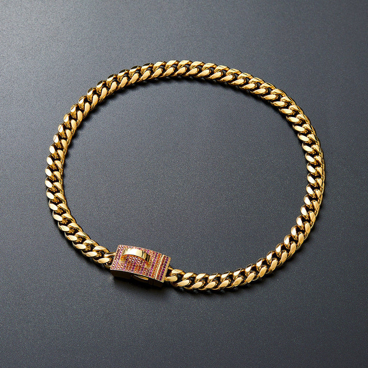 Gold-tone chain collar with pink-accented clasp