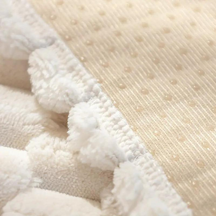 Close-up of the textured fabric of Nordic Knit Sofa Cover – Non-Slip Furniture Protector showcasing soft and cozy layers.
