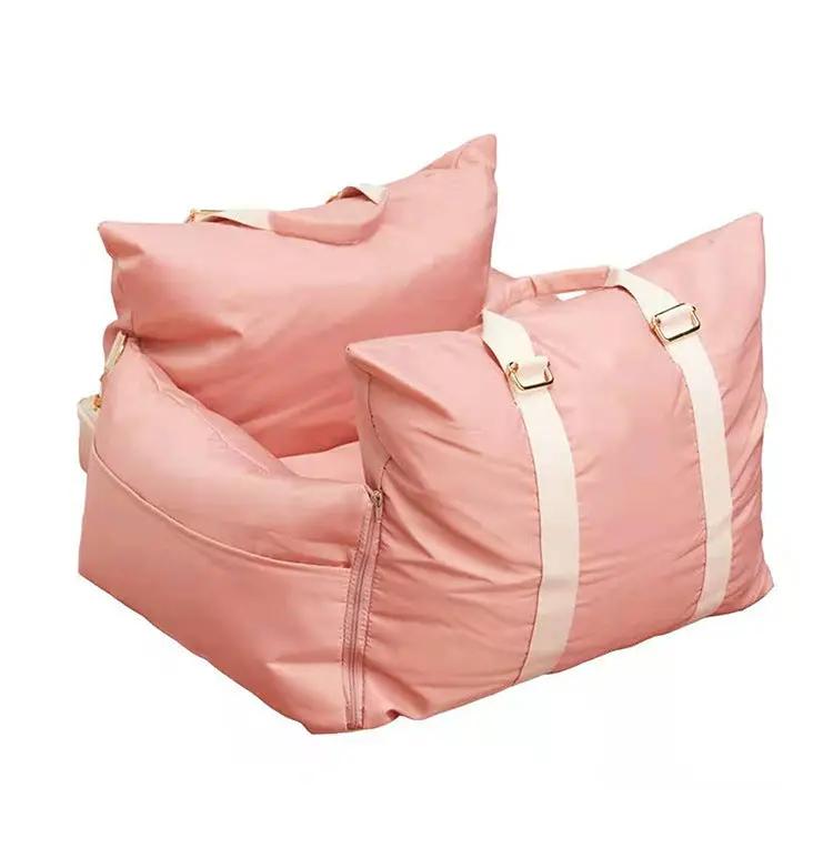 Outbound Travel Portable Car Pet Nest in pink with white straps, car crate-style pet carrier.