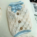 Load image into Gallery viewer, Knitted dog sweater by Pet Zen in cream with blue ribbed collar and bow, buttoned front
