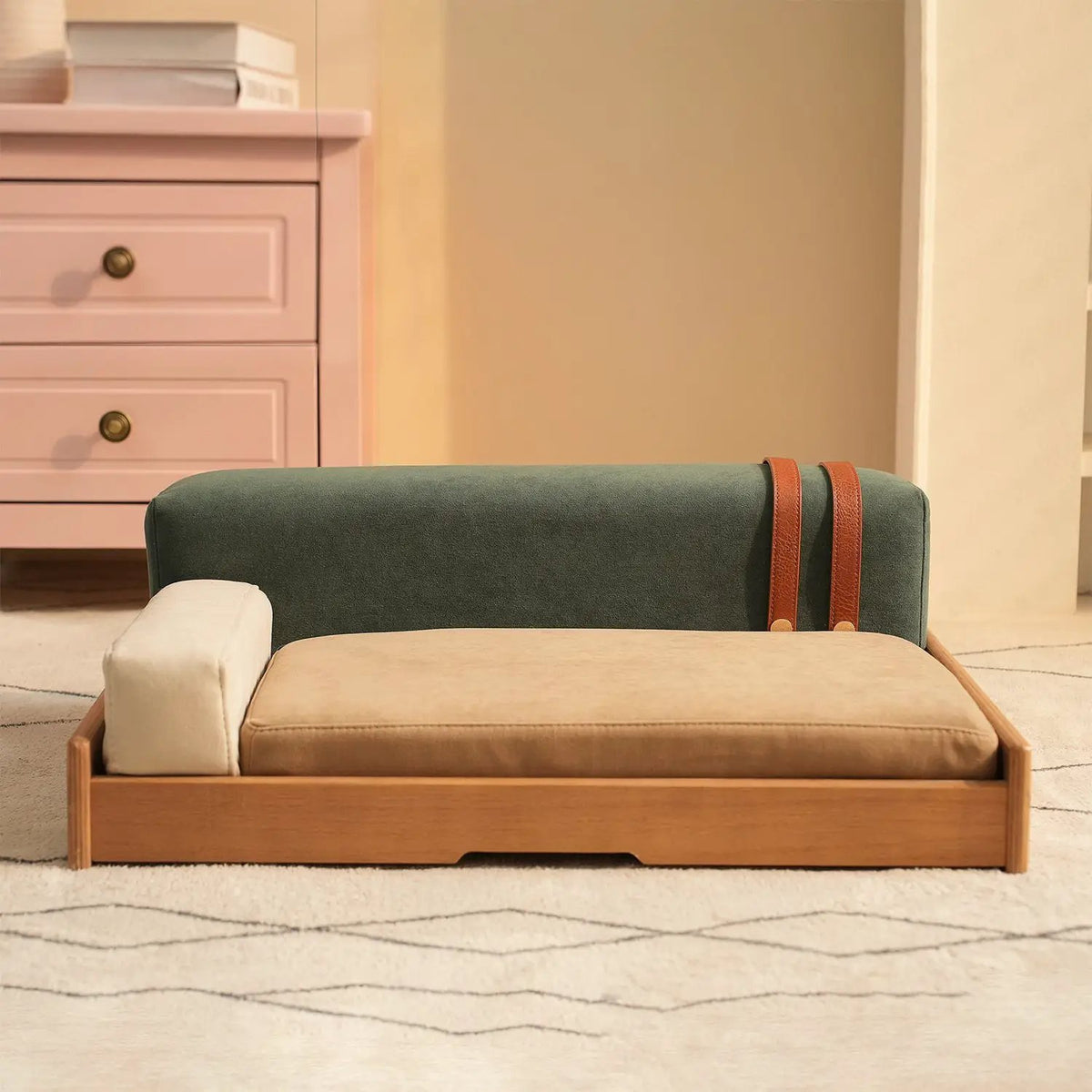 Modern wooden pet bed by Home Furnishers for cats and dogs, with a natural wood frame and green backrest.