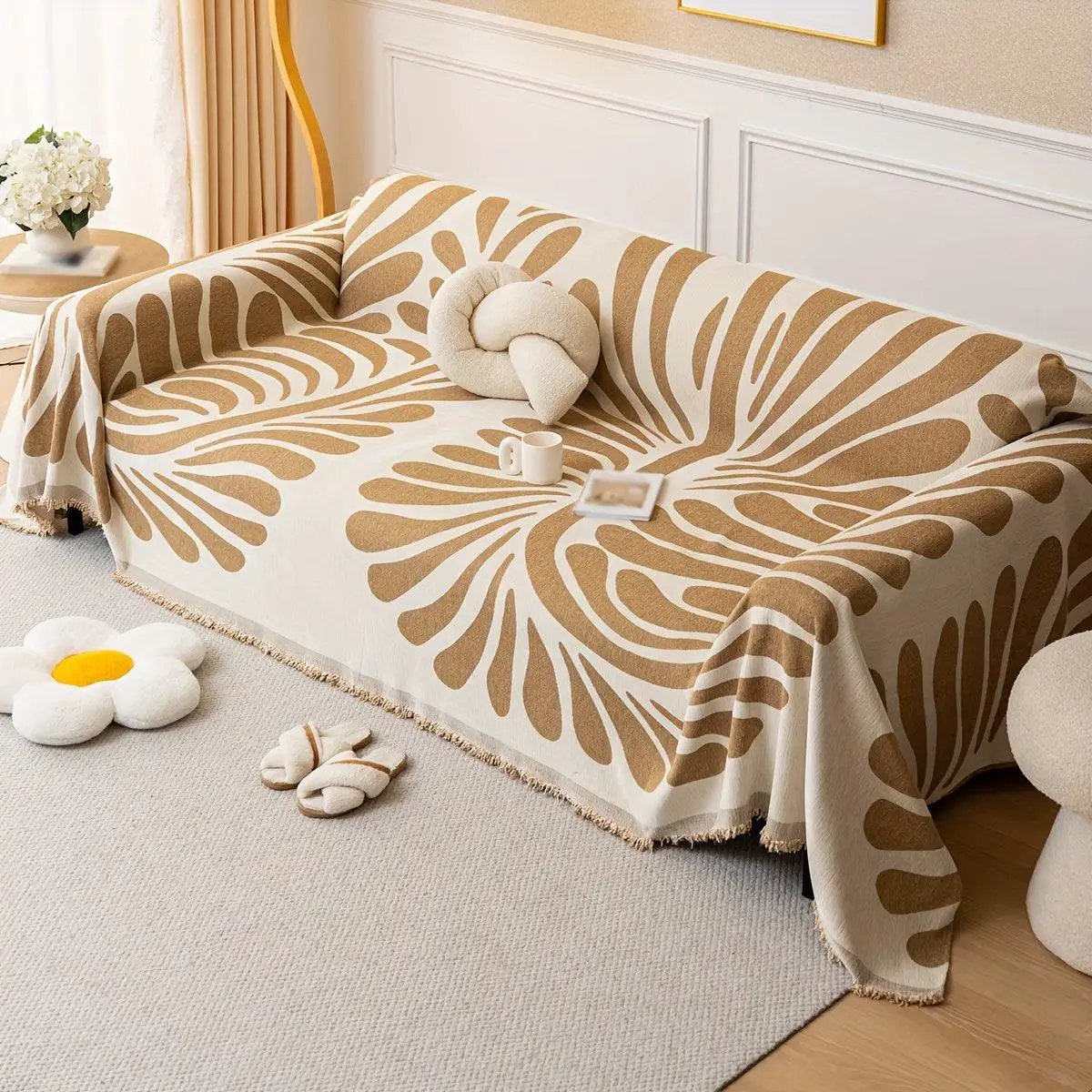 Versatile chenille sofa cover in cream with orange pattern, pet-friendly