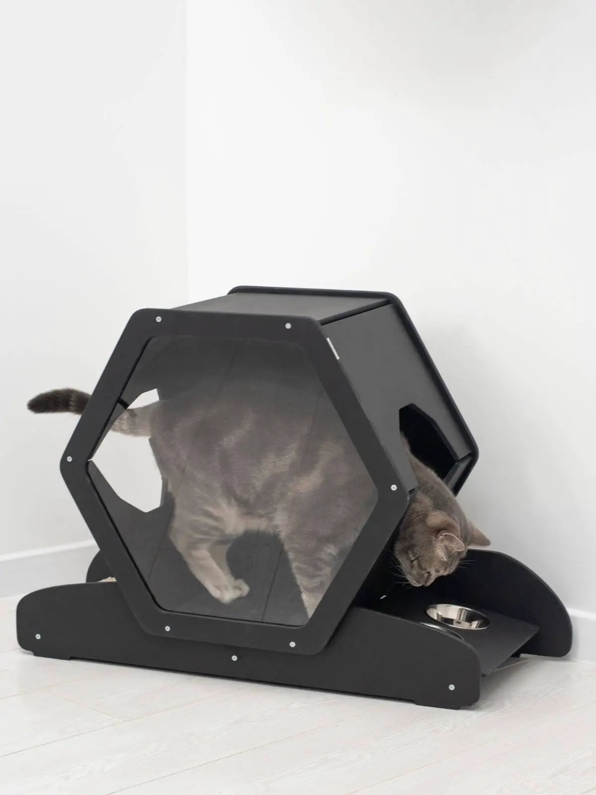 Small cat house by Enjoy The Wood B2B, black hexagonal cat condo with a clear panel.